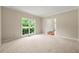 Bright living room with natural light and neutral carpet at 3060 Robertswood Dr, Powder Springs, GA 30127