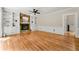 Bright living room with hardwood floors and a stone fireplace at 3060 Robertswood Dr, Powder Springs, GA 30127