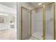 Newly renovated shower with glass door enclosure and bright white tiles in main bathroom at 3060 Robertswood Dr, Powder Springs, GA 30127