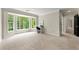 Bright and airy sitting area with large bay windows offering ample natural light and scenic views at 3060 Robertswood Dr, Powder Springs, GA 30127