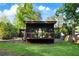 Modern home featuring a well-manicured backyard, a patio, and lush landscaping at 3740 Powers Ferry Nw Rd, Atlanta, GA 30342