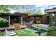 Resort-style backyard with a pool, spa, and modern architectural elements at 3740 Powers Ferry Nw Rd, Atlanta, GA 30342