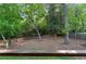 View of the peaceful and serene backyard, fully surrounded by mature trees at 3740 Powers Ferry Nw Rd, Atlanta, GA 30342