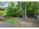 Spacious backyard bordered by mature trees and a well-maintained wooden fence at 3740 Powers Ferry Nw Rd, Atlanta, GA 30342