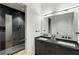 A bathroom with a glass shower, a gray vanity, and a large mirror at 3740 Powers Ferry Nw Rd, Atlanta, GA 30342