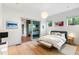 Bright bedroom with hardwood floors, an ensuite bathroom, and large windows for natural light at 3740 Powers Ferry Nw Rd, Atlanta, GA 30342