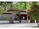 Modern home featuring a flat roof, expansive windows, and sleek architectural details at 3740 Powers Ferry Nw Rd, Atlanta, GA 30342