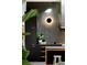 Modern kitchen with dark cabinetry, contrasting countertops, and a design accented by a stylish wall sconce at 3740 Powers Ferry Nw Rd, Atlanta, GA 30342