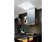 This is a modern kitchen with a stylish range hood and a skylight that adds ample natural light at 3740 Powers Ferry Nw Rd, Atlanta, GA 30342
