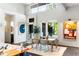 Stylish living room showcases a dining area, large windows with scenic views, and modern interior design at 3740 Powers Ferry Nw Rd, Atlanta, GA 30342