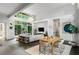 Open-concept living area with a dining table, comfortable seating, large windows, and abundant natural light at 3740 Powers Ferry Nw Rd, Atlanta, GA 30342