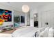 Bright primary bedroom with art, closet, ensuite access, and sliding door to deck at 3740 Powers Ferry Nw Rd, Atlanta, GA 30342