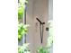 Modern tiled shower with sleek black fixtures and natural light filtering through lush greenery at 3740 Powers Ferry Nw Rd, Atlanta, GA 30342