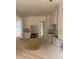 Unfinished kitchen featuring white cabinets and a center island, bathed in natural light at 933 Mount Carmel Church Ln, Canton, GA 30114