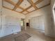 Open-concept living room with a coffered ceiling, wainscoting, and unfinished walls at 933 Mount Carmel Church Ln, Canton, GA 30114