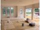 Unfinished living room featuring large windows and a view of the neighborhood at 933 Mount Carmel Church Ln, Canton, GA 30114