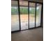 Large sliding glass doors in an unfinished room, providing access to a patio and backyard view at 933 Mount Carmel Church Ln, Canton, GA 30114