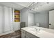 Spacious bathroom with built-in shelving, a wide mirror, and a neutral color scheme at 1130 Angelo Ne Ct, Atlanta, GA 30319