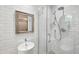 Modern bathroom featuring a glass-enclosed shower, white subway tile, and sleek fixtures at 1130 Angelo Ne Ct, Atlanta, GA 30319