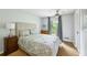 Calm bedroom with a large window, soft lighting, and a comfortably adorned bed at 1130 Angelo Ne Ct, Atlanta, GA 30319