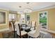 Chic dining area with a glass-top table, stylish chairs, and modern light fixtures at 1130 Angelo Ne Ct, Atlanta, GA 30319