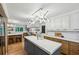 Bright, remodeled kitchen featuring modern lighting, a large island, and stainless steel appliances at 1130 Angelo Ne Ct, Atlanta, GA 30319
