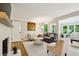 Cozy living room with a fireplace, comfortable seating, and stylish decor at 1130 Angelo Ne Ct, Atlanta, GA 30319