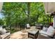 Expansive outdoor deck with modern furniture and serene wooded views perfect for entertaining at 1130 Angelo Ne Ct, Atlanta, GA 30319