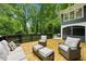 Secluded back deck features comfortable seating and tranquil views of mature trees at 1130 Angelo Ne Ct, Atlanta, GA 30319