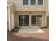 Back patio with sliding glass doors leading to backyard at 1295 Kilmington Ct, Alpharetta, GA 30009