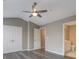 Expansive primary bedroom boasting hardwood floors, large windows, and an ensuite bathroom for added privacy and convenience at 1295 Kilmington Ct, Alpharetta, GA 30009