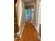 Welcoming entryway with gleaming hardwood floors, staircase, neutral paint, and a view of the outdoors at 1295 Kilmington Ct, Alpharetta, GA 30009