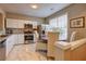 Bright kitchen with stainless steel appliances, white cabinets, marble flooring, and eat-in area at 1295 Kilmington Ct, Alpharetta, GA 30009