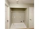 Functional laundry room with white tile flooring, closet, and hook-ups, ready for your washer and dryer at 1295 Kilmington Ct, Alpharetta, GA 30009