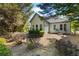 The charming home features a well-maintained backyard with mature trees, offering a peaceful retreat at 401 Azalea Cv, Canton, GA 30114