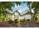 Lovely single-story home with lush landscaping, accentuating its architectural features at 401 Azalea Cv, Canton, GA 30114