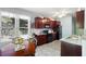 Eat-in kitchen with stainless appliances and cherry cabinets at 401 Azalea Cv, Canton, GA 30114