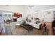 Spacious living room open to dining area, featuring hardwood floors and a cozy seating arrangement at 401 Azalea Cv, Canton, GA 30114