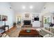 Bright living room with fireplace and sliding glass doors at 401 Azalea Cv, Canton, GA 30114