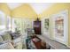 Bright sunroom with lots of windows and sliding glass door at 401 Azalea Cv, Canton, GA 30114