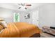 Bedroom featuring a ceiling fan, flat screen television, and comfortable bedding at 9955 Rivertown Rd, Fairburn, GA 30213