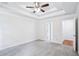 Spacious bedroom with tray ceiling, ceiling fan, with an ensuite bathroom and walk-in closet at 10 Hollow Ct, Covington, GA 30016