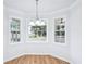 Charming breakfast nook featuring hardwood floors, large windows offering ample natural light, creating a cozy dining space at 10 Hollow Ct, Covington, GA 30016