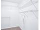 An empty walk-in closet featuring wire shelving on the back and side walls of this storage space at 10 Hollow Ct, Covington, GA 30016