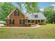 Charming brick home with a manicured lawn and inviting front porch, perfect for relaxing and enjoying the neighborhood at 10 Hollow Ct, Covington, GA 30016