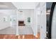 Bright living room with hardwood floors, fireplace, and large windows that fill the space with natural light at 10 Hollow Ct, Covington, GA 30016
