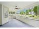 Enjoy the screened porch with outdoor ceiling fan and great views of the backyard at 10 Hollow Ct, Covington, GA 30016
