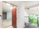 Inviting entryway featuring unit number, doorbell, and view into the main living space at 1818 Huntingdon Chase, Atlanta, GA 30350