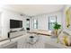 Bright living room with large windows, plush seating, and contemporary decor for a relaxing atmosphere at 1818 Huntingdon Chase, Atlanta, GA 30350