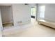 Neutral living room space showcasing carpeted floors, natural light, and minimalist design at 1818 Huntingdon Chase, Atlanta, GA 30350